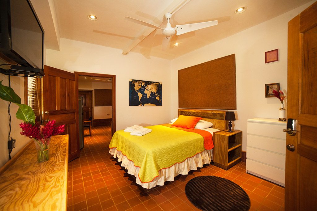 The queen size bed in Casa Escultura 1 is comfortable in one of the best apartments for rent in Bocas del Toro.