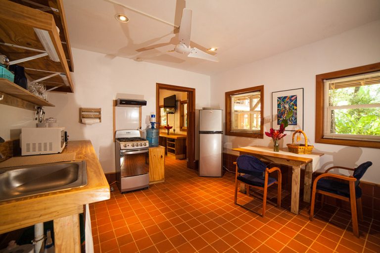 The one bedroom apartment for rent in bocas del toro features a spacious kitchen and dining area.